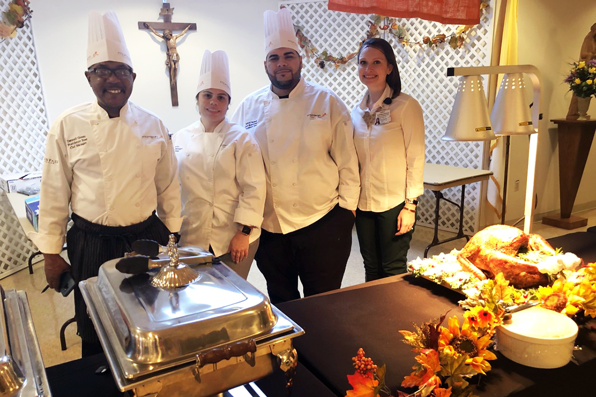 Providence Rest Chefs serving food in chafing dishes.